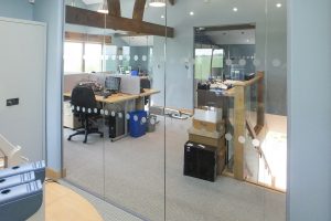 15, Frameless glass office partitioning including full height frameless glass door