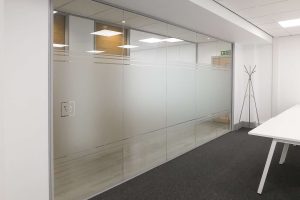 Glass office wall with banded manifestation detailing