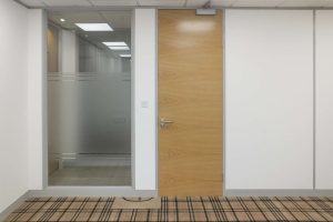 Glazed office sidelight with window film detailing