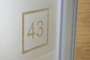 Manifestation office window film with number cut out