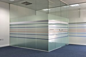 Floor to ceiling height frameless glass partitioning