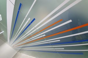 Toughened frameless glass partitioning with window film